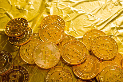 Close-up of bitcoins on golden paper