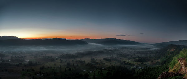 Scenic view of mountains against sky during sunset