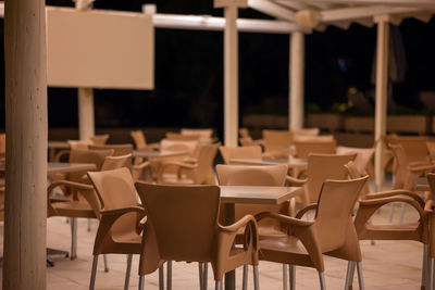 Close-up of empty chairs in cafe