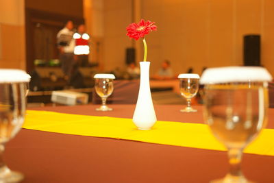 Close-up of wine glasses on table in restaurant