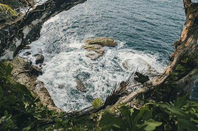 High angle view of rocks in sea