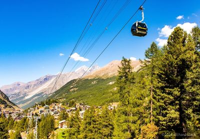 Overhead cable car against mountains