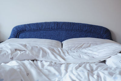 Close-up of blanket on bed at home