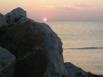 Scenic view of sea at sunset