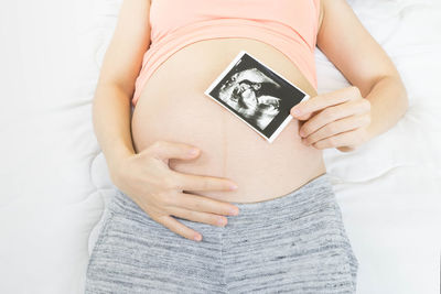 Midsection of woman with hands