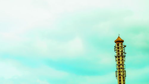 Low angle view of built structure against cloudy sky