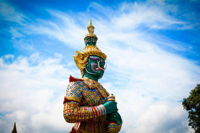 Low angle view of statue against sky