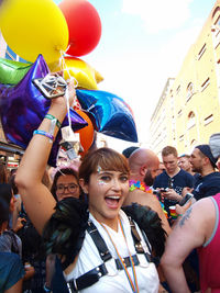 High angle view of people with balloons against sky