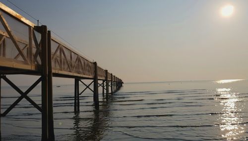 Scenic view of sea against clear sky during sunset