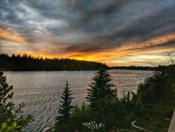 Scenic view of lake against sky during sunset