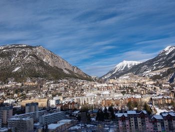 Aerial view of townscape against sky