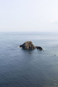 Scenic view of rock in the middle of the sea