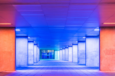 Empty corridor illuminated at night