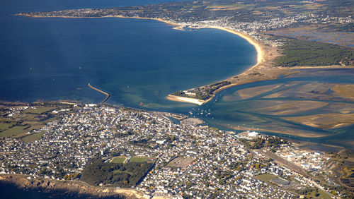 High angle view of sea and buildings in city