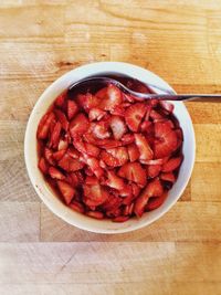 High angle view of chopped fruits in bowl on table