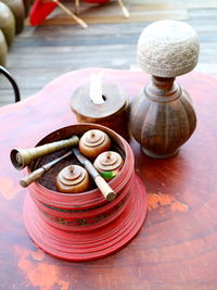 High angle view of betel box on wooden table