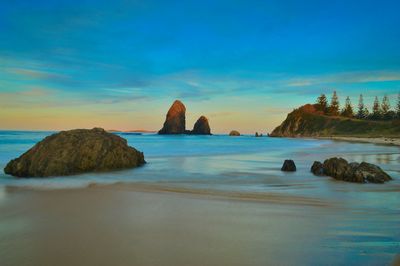 Scenic view of sea against blue sky