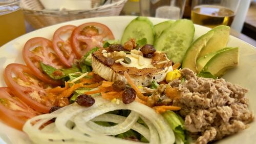 Close-up of food mediterraean salad with grilled goat cheese and tuna 