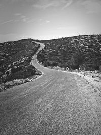 Road leading towards mountains