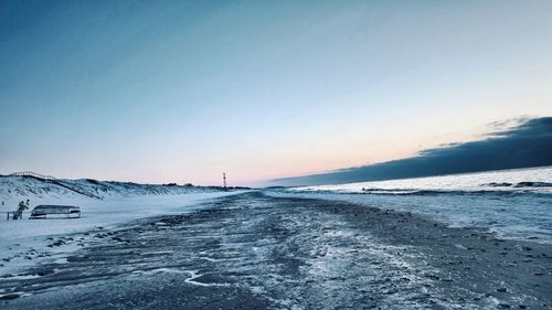 Scenic view of frozen sea against clear sky during winter