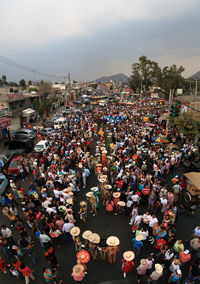 High angle view of crowd on street against sky