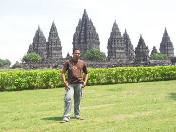 Full length of friends standing at temple