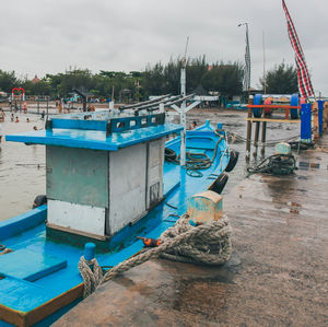 Boats moored at harbor