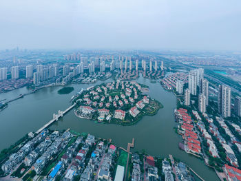 High angle view of river amidst buildings in city