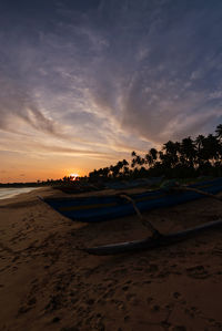 Scenic view of beach against sky during sunset