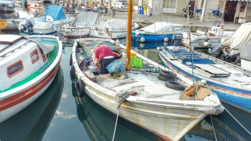 High angle view of boats moored at harbor