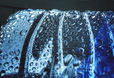 Close-up of water drops on metal