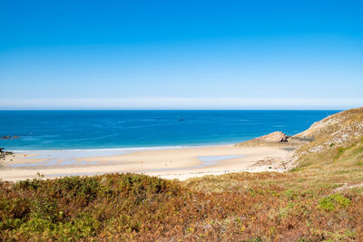 Scenic view of sea against clear blue sky