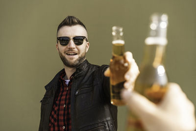 Portrait of young man wearing sunglasses