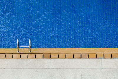 Low angle view of wall against blue sky