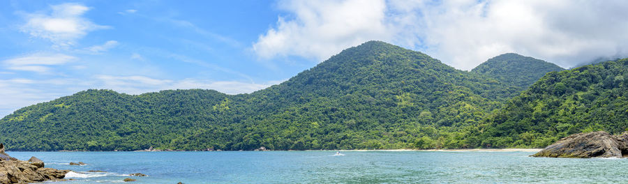 Panoramic image of rain forest, hills and sea of trindade, rj