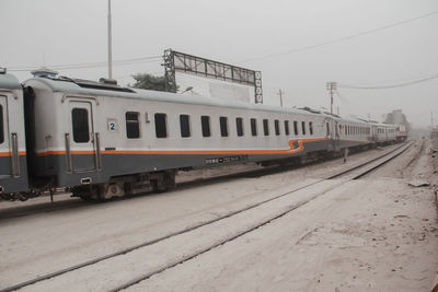 Train on railroad track against sky