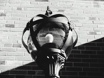 Close-up of fire hydrant on brick wall
