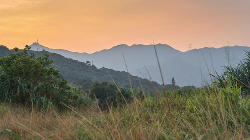 Scenic view of mountains against sky during sunset