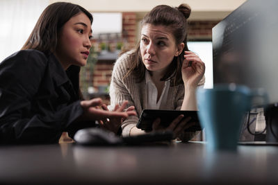 Business colleagues having discussion at office