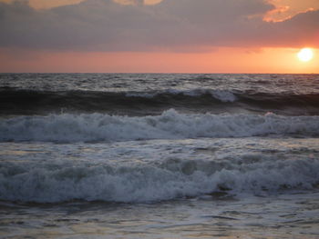 Scenic view of sea at sunset