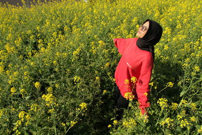 Full length of woman standing on field