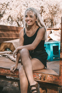 Woman sitting on truck