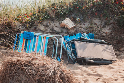 Empty chairs on beach
