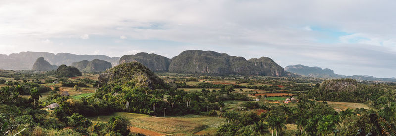 Scenic view of landscape and mountains against sky