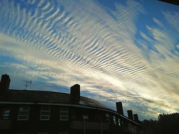 Low angle view of vapor trails in sky