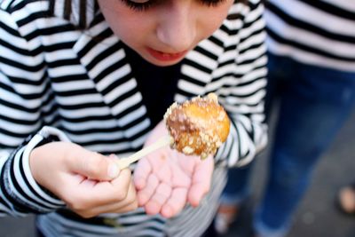 Close-up of girl eating food