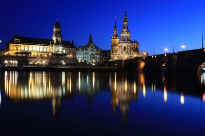 Reflection of illuminated buildings in water at night