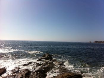 Scenic view of sea against clear sky