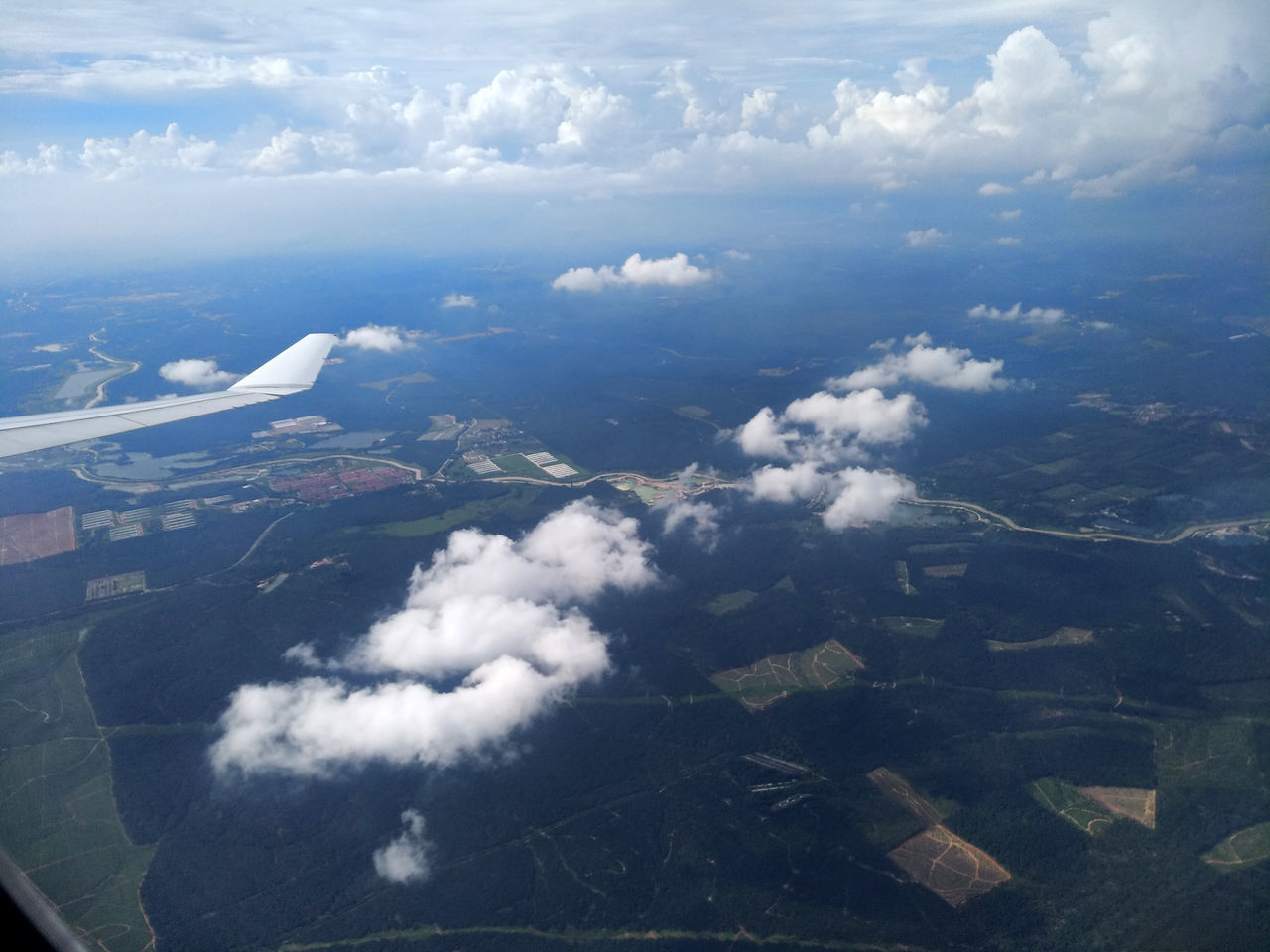 AERIAL VIEW OF CLOUDS OVER LAND