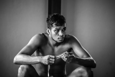 Portrait of young man sitting